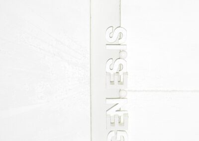 Close-up of the white 3D inscription GEN.ES.IS positioned vertically within the central gap, acting as an architectural axis and conceptual origin in PAGE ZERO.