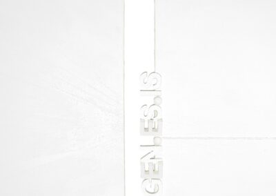 PAGE ZERO by Kiéra Nagy (K-NY) in daylight. Minimalist diptych in pure white with architectural precision. A vertical central gap defines the structure; GEN.ES.IS appears as a subtle spatial element above the division. Matte surfaces, reduced composition, and controlled balance emphasize the origin state of the work.