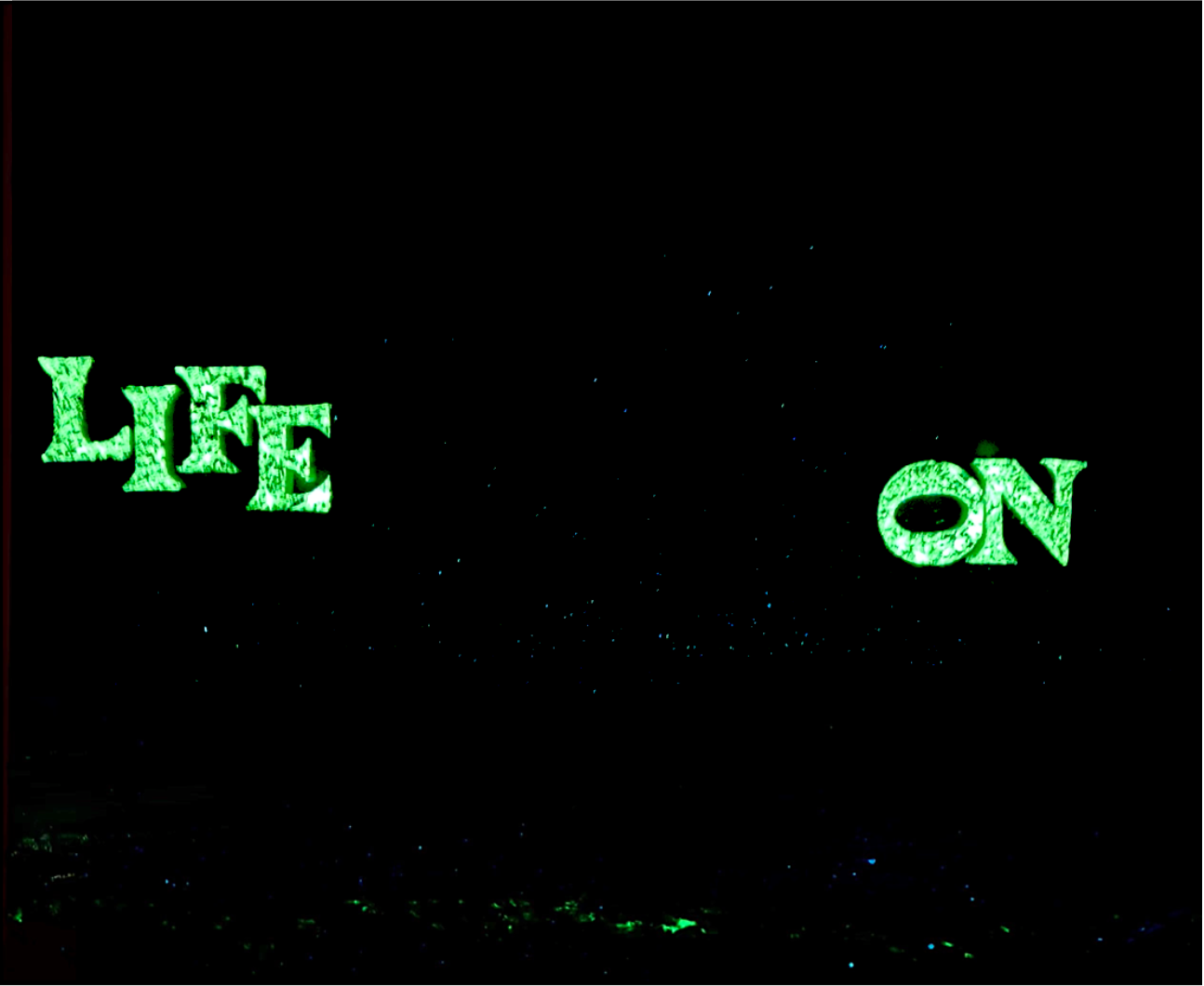 LIFE ON by K-NY — photoluminescent conceptual artwork activated in darkness, dual-spectrum composition revealing structural light within spatial context