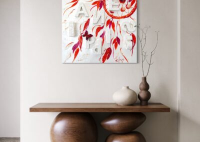 HAPPINESS by K-NY installed in a contemporary interior. A mixed-media artwork from the INNER FIRE cluster exploring joy as an internal state rather than an external event. The composition combines layered textures, handwritten elements and subtle three-dimensional structures. By day, the work appears light, open and atmospheric; by night, photoluminescent elements reveal a second perceptual reality.