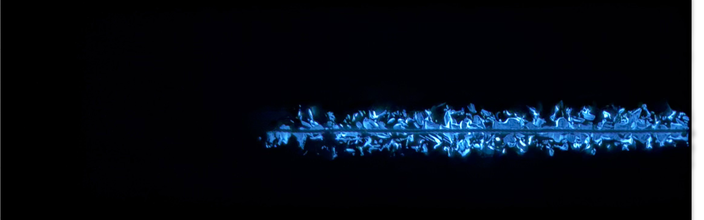 THE RED THREAD by K-NY at night — photoluminescent white line remains visible in darkness as a directional structure within the INNER FIRE cluster.