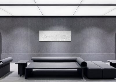 THE RED THREAD by K-NY in interior space — large-scale monochrome mixed-media work with white linear structure creating psychological tension, orientation, and spatial calm.