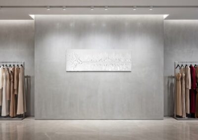 THE RED THREAD by K-NY in interior space — large-scale monochrome mixed-media work with white linear structure creating psychological tension, orientation, and spatial calm.